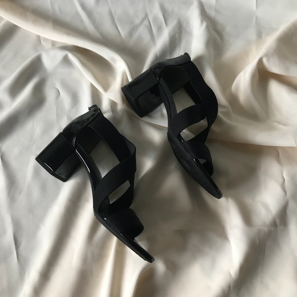 Black patent and elastic heels by Bandolino
